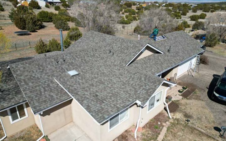 Residential Roof Project Completion A finished roofing project on a home with updated shingles, featuring a clean finish and structural integrity.