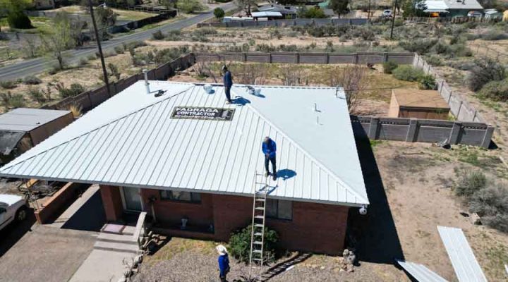 Fadraga General contractor team installing a metal roof on a residential building, enhancing its durability and aesthetic appeal.